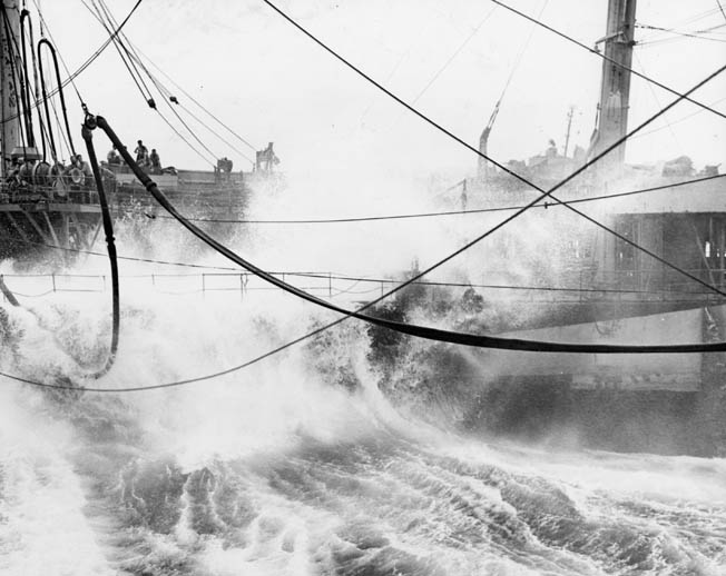 The tanker USS Atascosa attempts to refuel the aircraft carrier USS Lexington during the heavy typhoon known as Cobra in December 1944. 