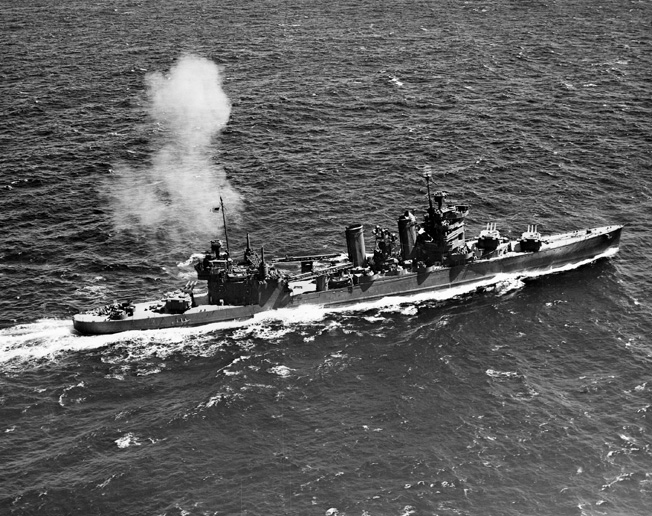 The USS Astoria fires its 8-inch guns during gunnery practice off Hawaii in July 1942. Within minutes of meeting the Japanese off Savo Island, the Astoria was in flames.