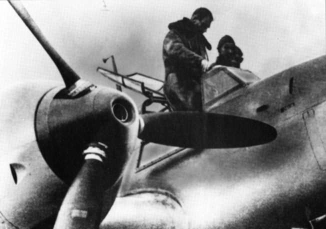 Rudolf Hess stands in the cockpit of the Me-110 he flew to Scotland prior to a test flight. 