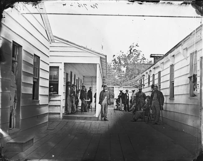 Convalescing soldiers and staff outside a Sanitary Commission lodge, one of 30 such facilities operated by the Commission in Washington during the war. Whitman didn’t think much of the Sanitary Commission.