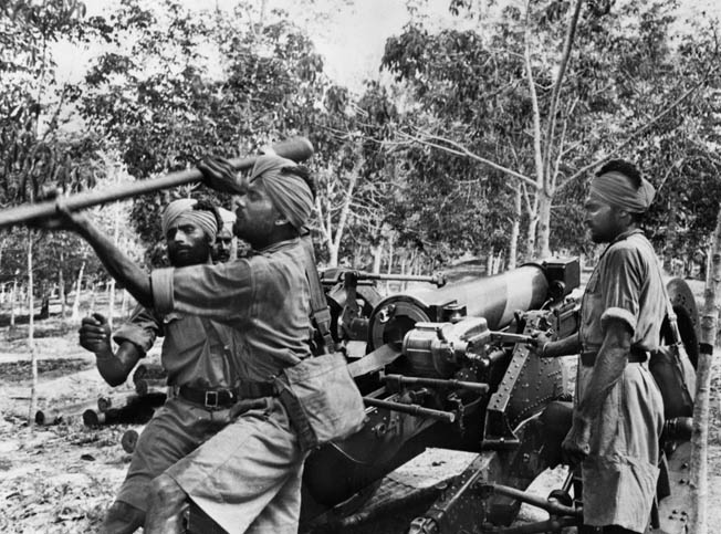 Soldiers from other parts of the British Empire defended Singapore. Here, Sikh soldiers train with an artillery piece in late 1941. They would be overrun by the Japanese.