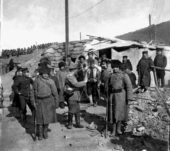 Japanese sentries relieve their Russian counterparts following the formal Russian surrender of Port Arthur on January 1, 1905. The victors sustained at least 60,000 casualties during the brutal five-month siege.