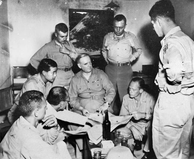 General William “Wild Bill” Donovan meets with his officers in the city of X’ian, China. Donovan created a separate OSS intelligence collection apparatus in Chinato conduct his own OSS operations.