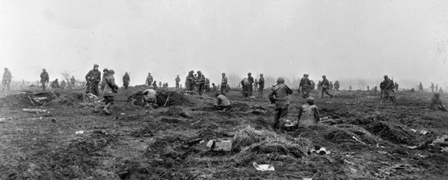 On the morning of December 20, 1944, the day after Walter and his platoon safely arrived inside American lines, soldiers of Companies A, B, C, and D, 393rd Infantry Regiment, 99th Division reposition their foxholes in the vicinity of the town of Elsenborn.