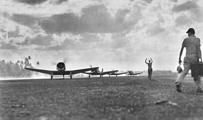 SBD Dauntless dive bombers of the 1st Marine Air Wing return from a mission providing close front-line support for Army ground troops in the Philippines. Inter-service rivalries were forgotten and close cooperation was the hallmark of combined air-ground operations. 