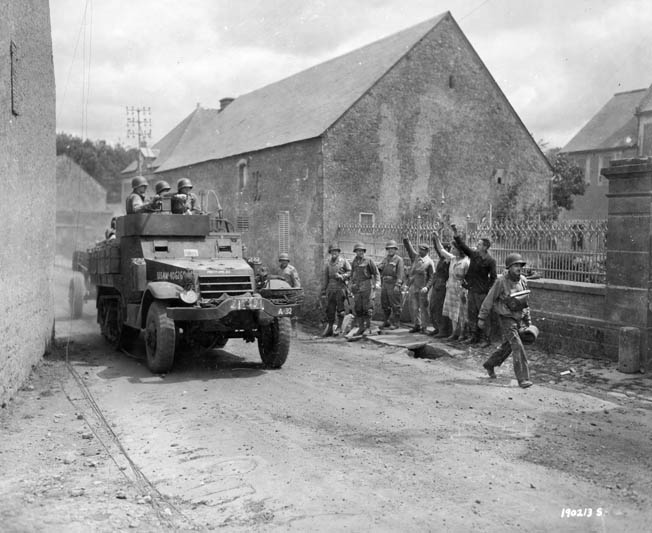 Ralph Puhalovich was a member of a half-track crew such as this one, pulling an antitank gun through a French village a week after the invasion. 