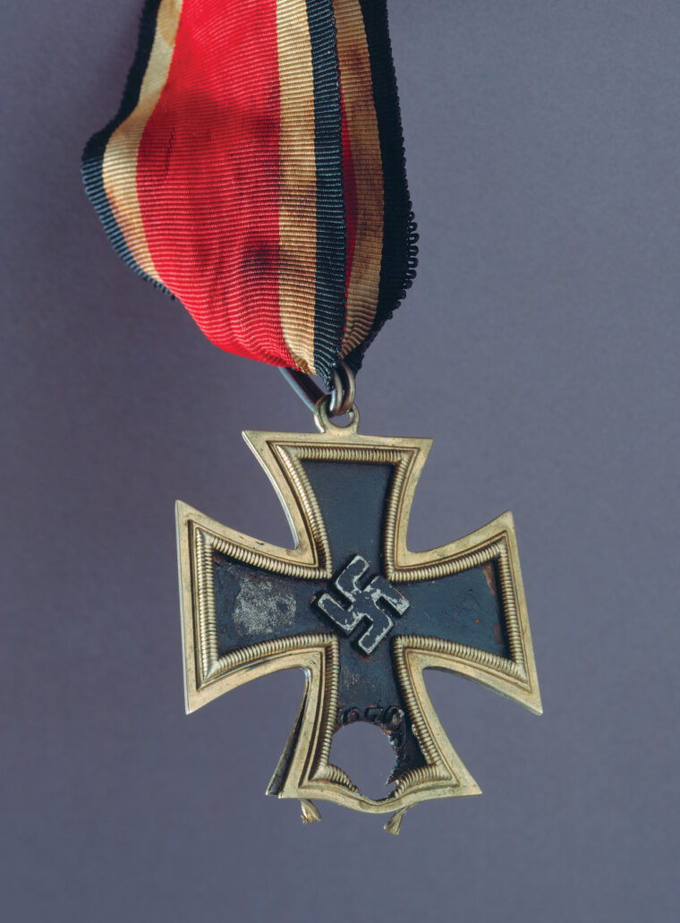 The Knight’s Cross worn by Luftwaffe Major Graf von der Schulenburg, who was killed at St. Lo on July 14, 1944. The bullet hole is from a machine gun.