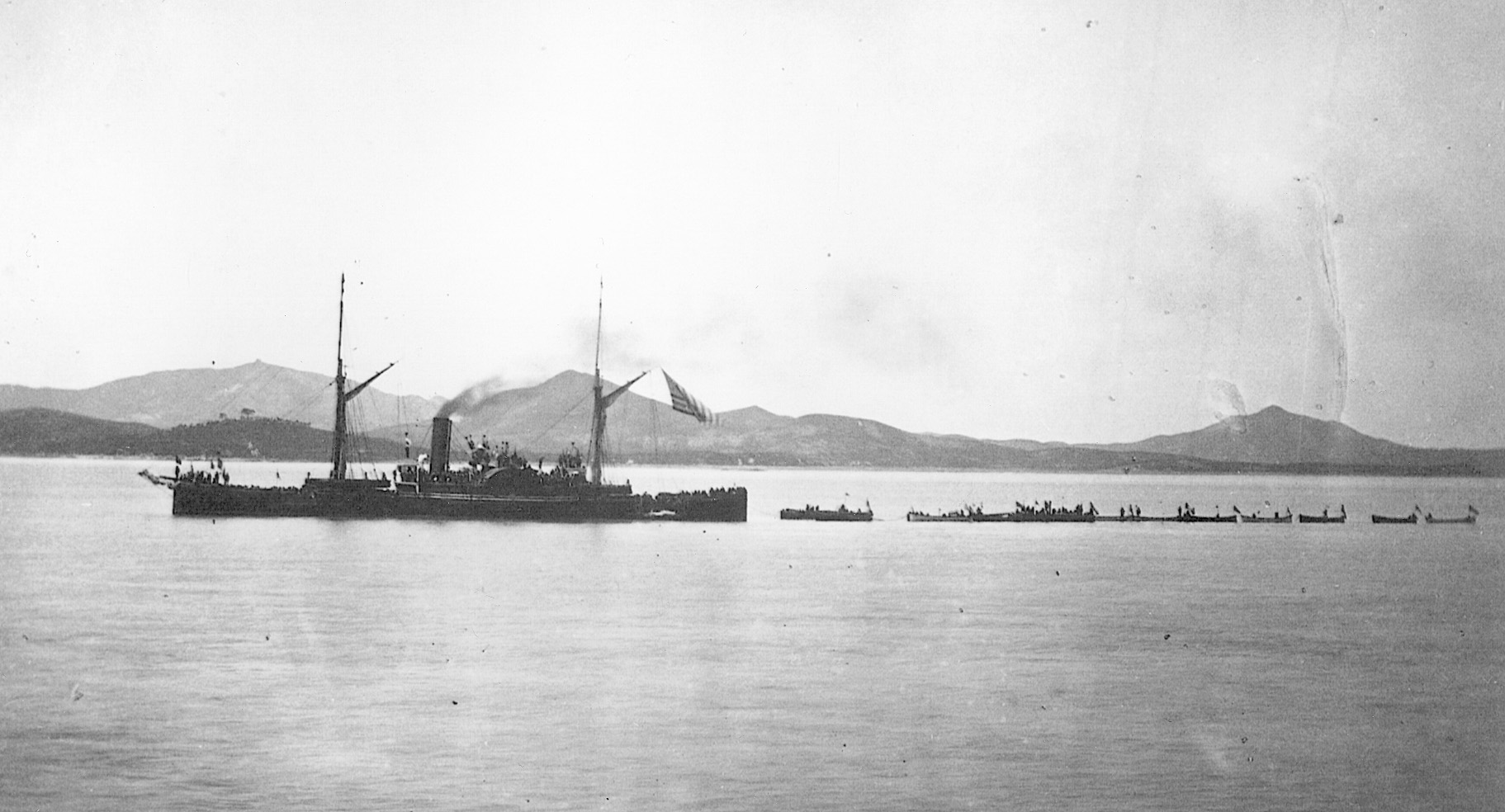 The sidewheeler USS Monocay tows landing force boats.