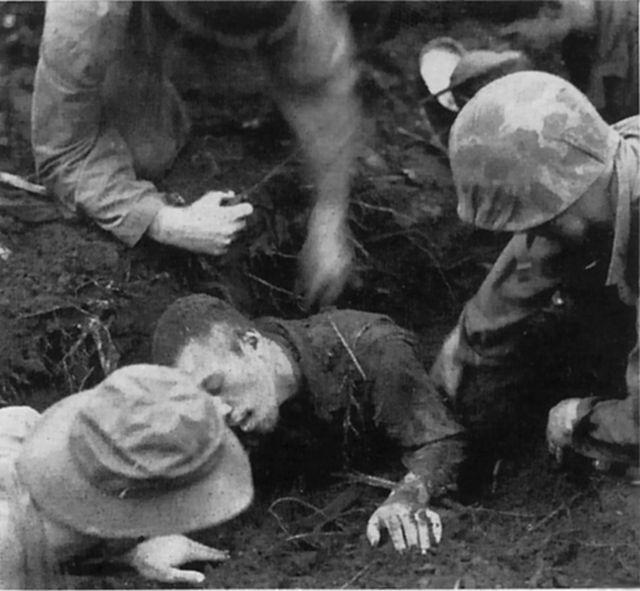 Identified as a Corporal Shigeto, this Japanese soldier was pulled from the remains of his bunker and taken prisoner following intense fire by American guns. 