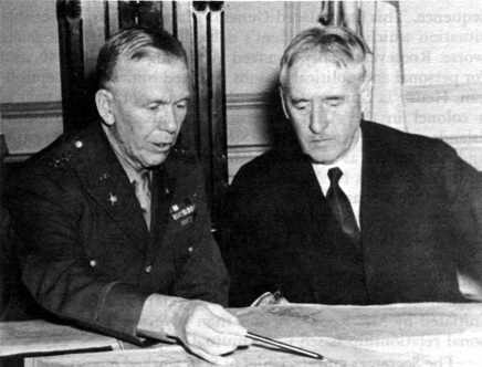 George C. Marshall (right) in discussion with Secretary of War Henry Stimson.