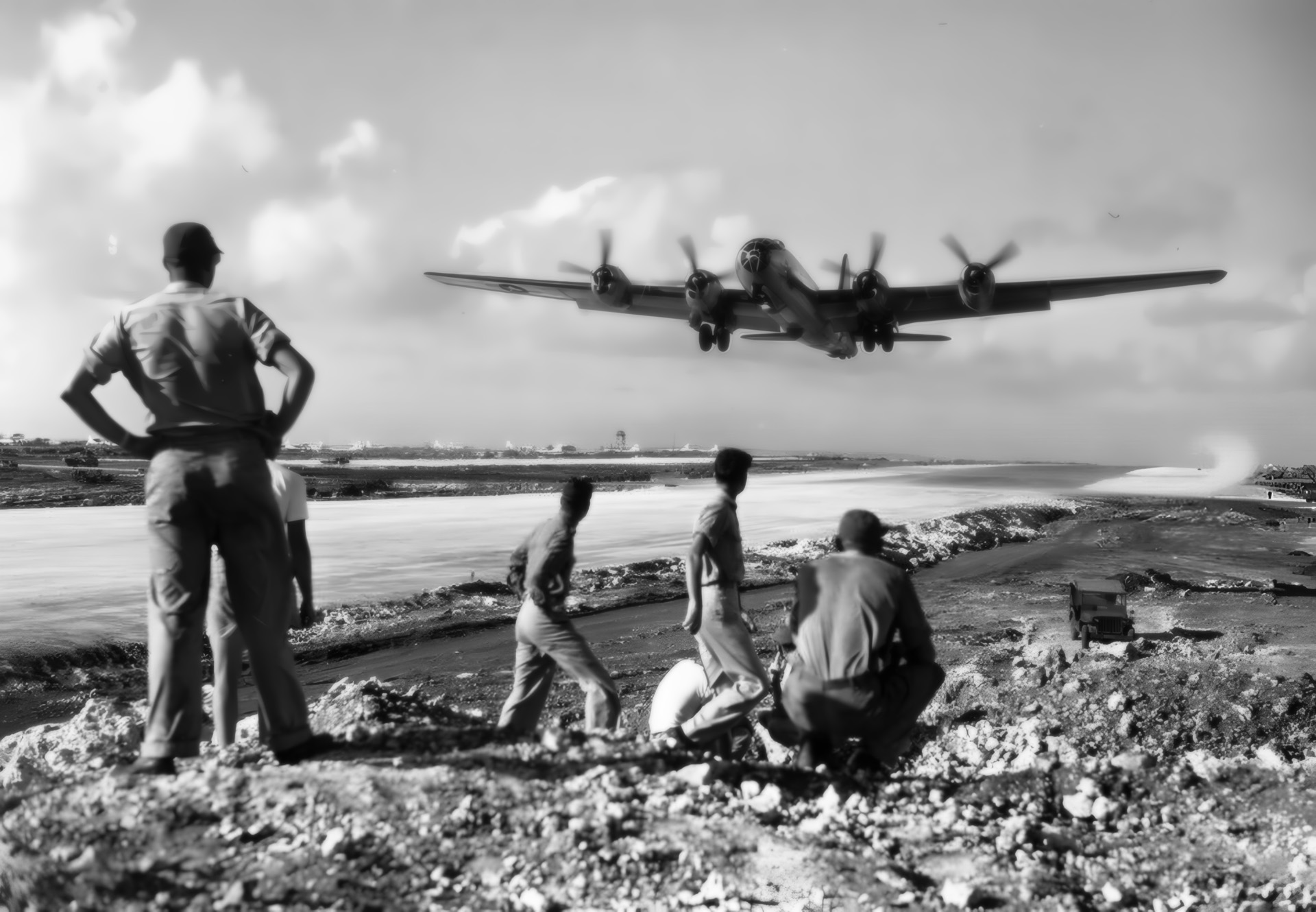 Ground crewmen watch as a B-29 Superfortress takes off from Saipan. Other bombers left from Guam and Tinian and converged over Tokyo.