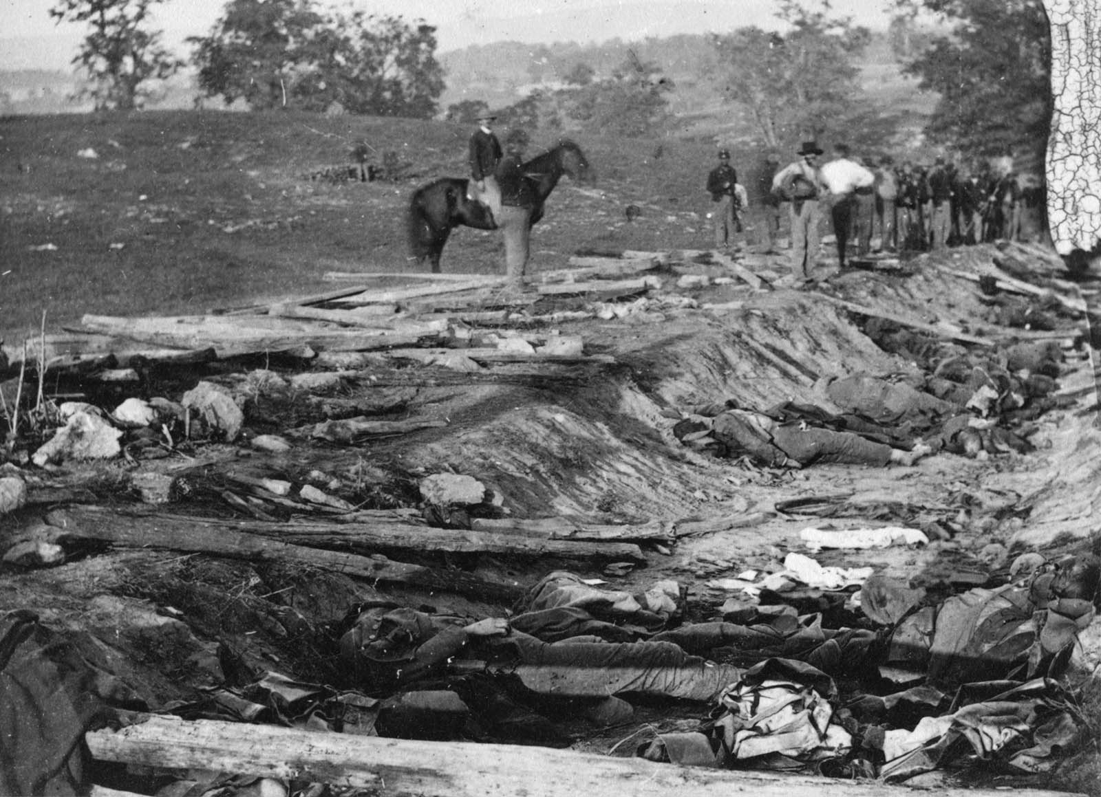 Union troops in the 130th Pennsylvania Infantry inspect piles of Confederate bodies in the all-too-descriptive “Bloody Lane” at Antietam. More than 4,800 soldiers in the two armies were killed in the one-day battle, the bloodiest single day in American history.