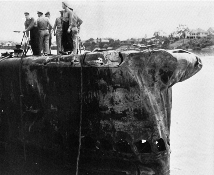 Navy personnel atop the Growler at Brisbane, Australia. The damage to a 25-foot section of the submarine’s bow, which occurred when it was rammed by the 900-ton Japanese cargo ship Hayasaki, can be clearly seen.
