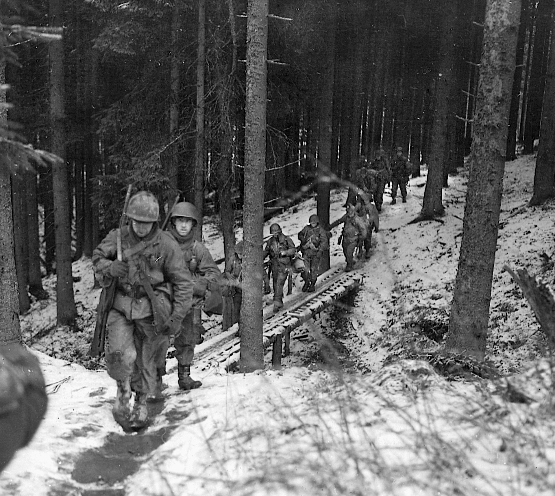 Volksgrenadiers of General der Artillerie Walter Lucht's LXVI Corps were tasked with eliminating the U.S. 106th Division deployed in the snow-covered hills east of St. Vith.