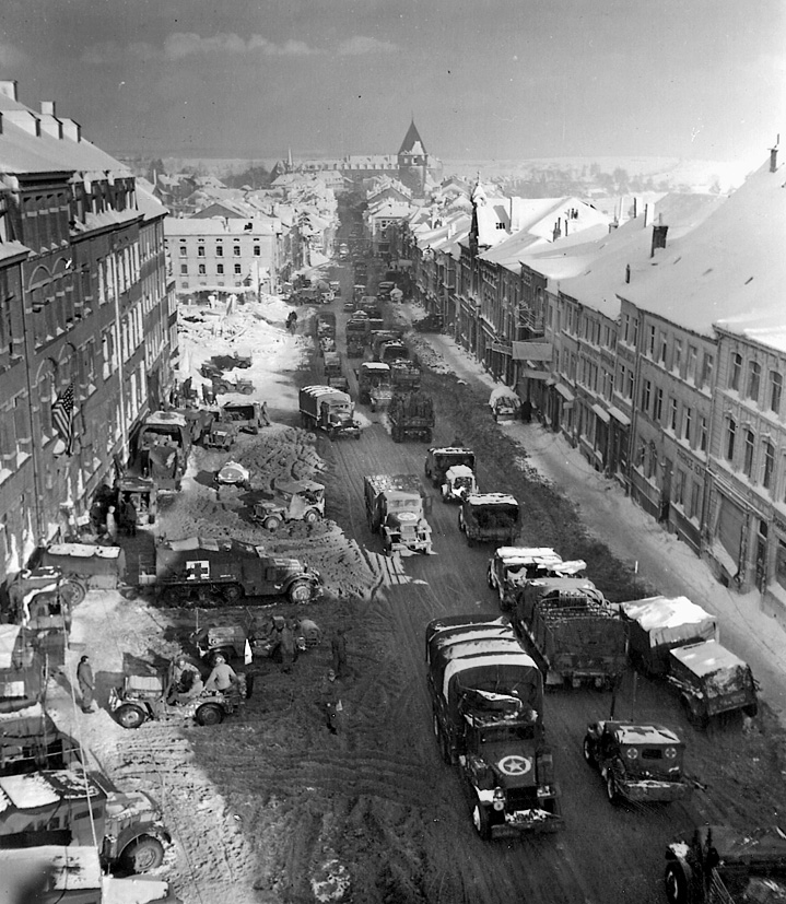 American vehicles are shown in the streets of Bastogne. By January 25, the Allies had completely erased the bulge in their lines.