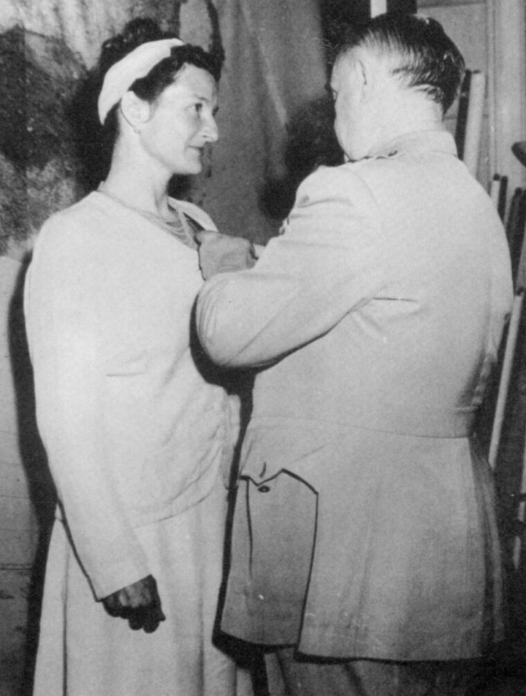 General William “Wild Bill” Donovan, head of the OSS, presents the Distinguished Service Cross to Virginia Hall, 1945. 
