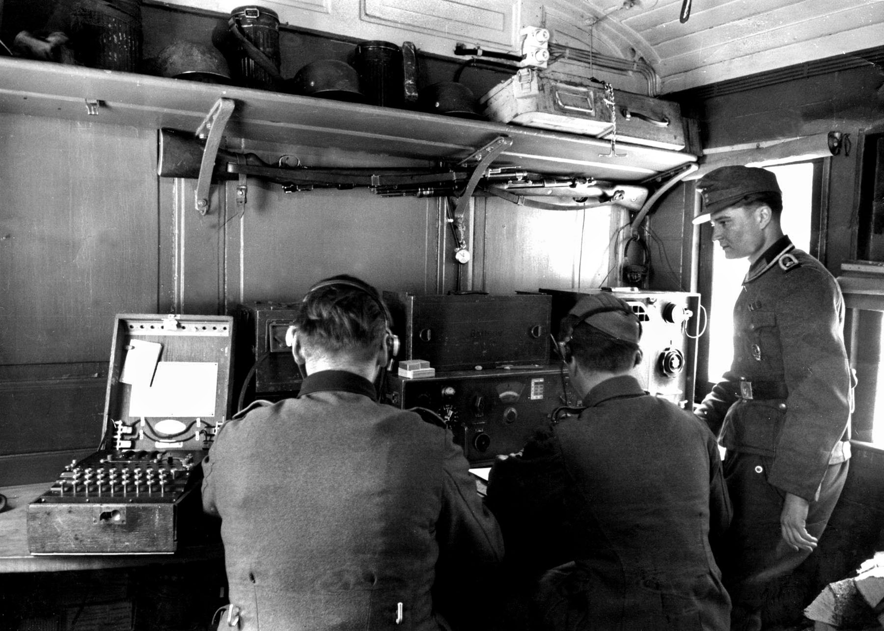 German soldiers operate the Enigma machine. British intelligence officials learned of Garbo’s existence through decrypted German radio messages.