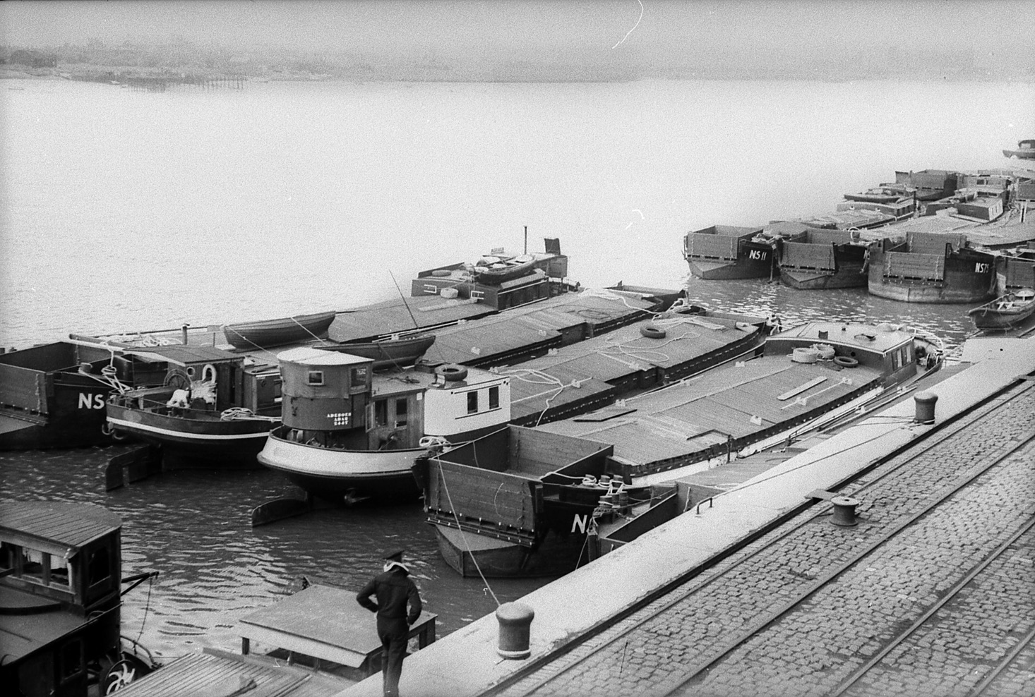 Invasion barges assembled at Wilhelmshaven to transport German soldiers across the Channel. The conversion of barges and other invasion vessels had absolute priority in shipyards in the summer of 1940, delaying the completion of U-boats and other warships. 