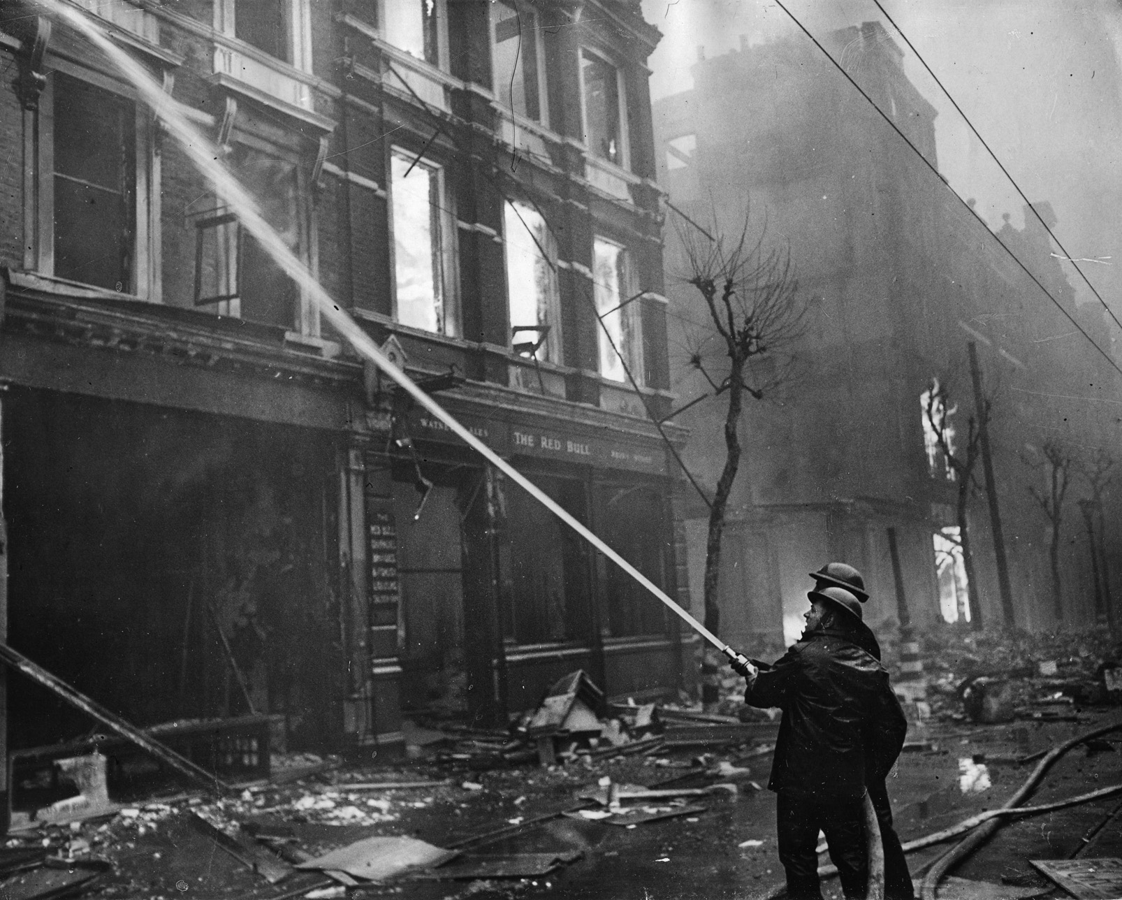 Firemen battle flames in London’s hard-hit East End during a German air raid during “the Blitz,” which lasted from September 7, 1940, to May 11, 1941, when Hitler decided to invade Russia instead of Britain. 