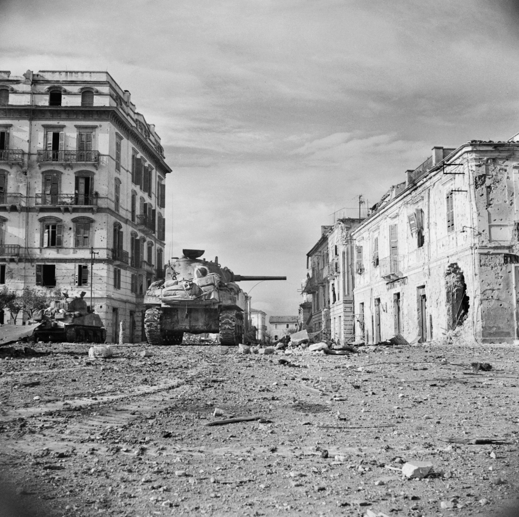 A pair of tanks from the Canadian Three Rivers Regiment advances into the center of Ortona on December 22, 1943. Armor played a key role supporting infantry of both sides in the hard-fought urban battle. 