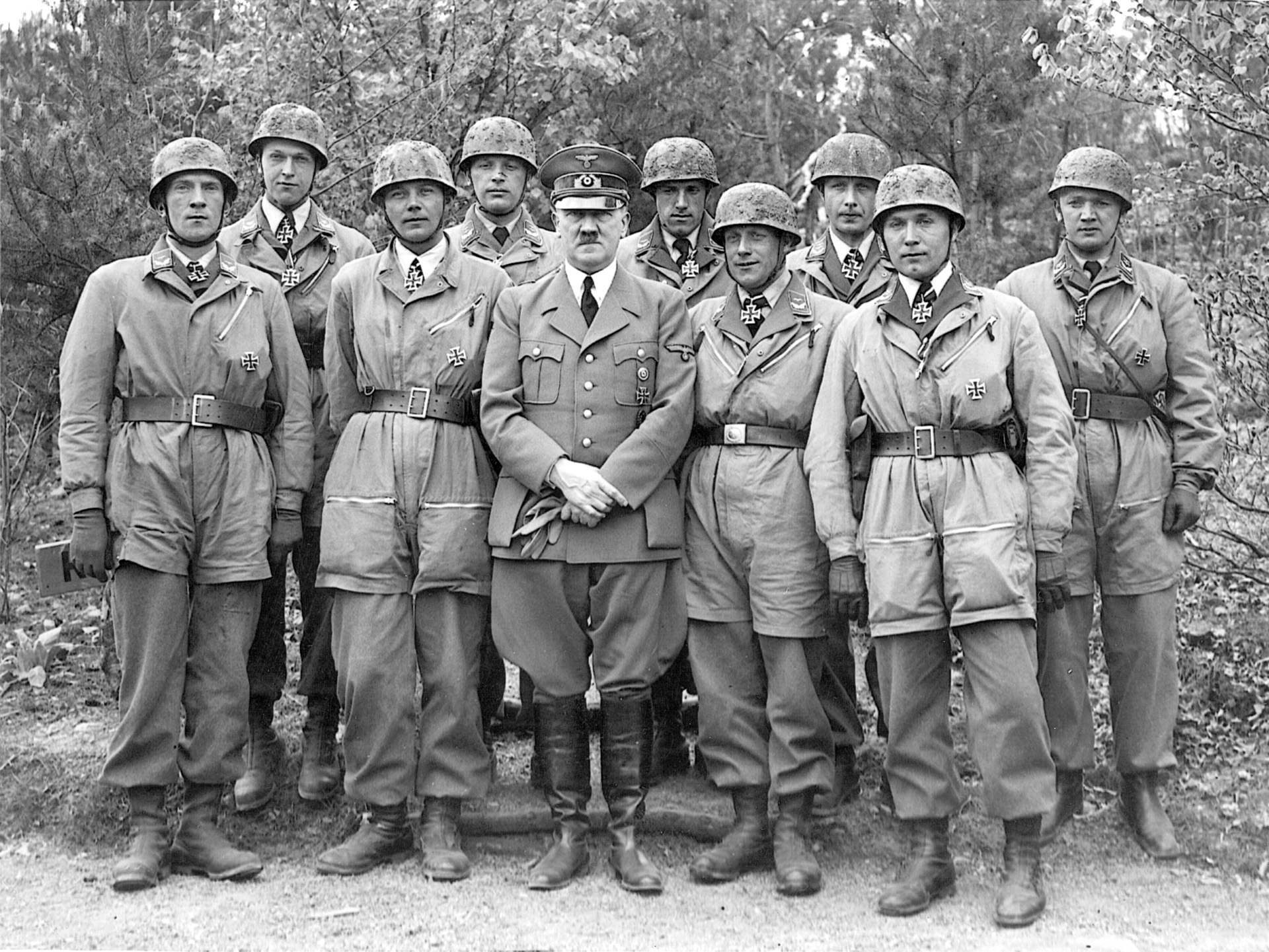 After their successful assault, decorated fallschirmjäger, including Oberleutnant Witzig (second from left) and Hauptmann Koch (third from left), pose with their Führer.