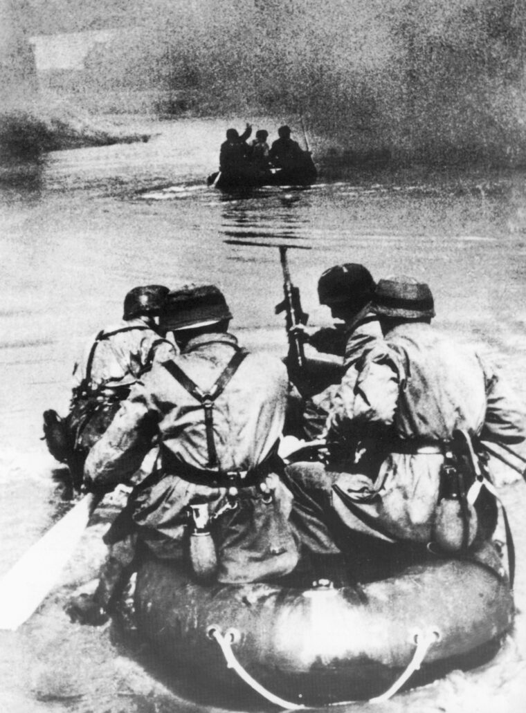 Using inflatable rafts, fallschirmjäger pioneers cross the Albert Canal to employ explosive charges and flamethrowers against Eben Emael.