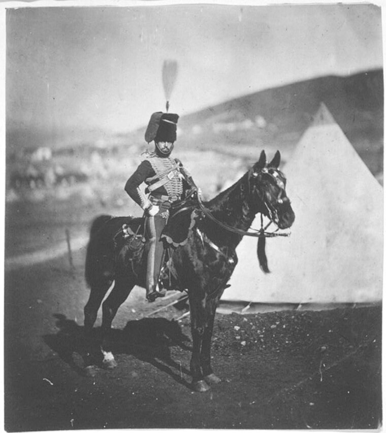 A member of the 11th Hussars and survivor of the Charge of the Light Brigade in the uniform he wore during the battle—except for the plume.