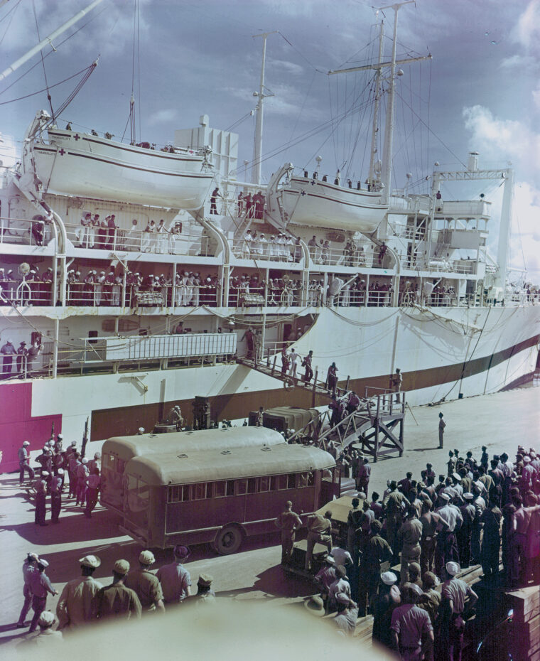 The USS Tranquility unloads Indianapolis survivors at Guam on August 8.