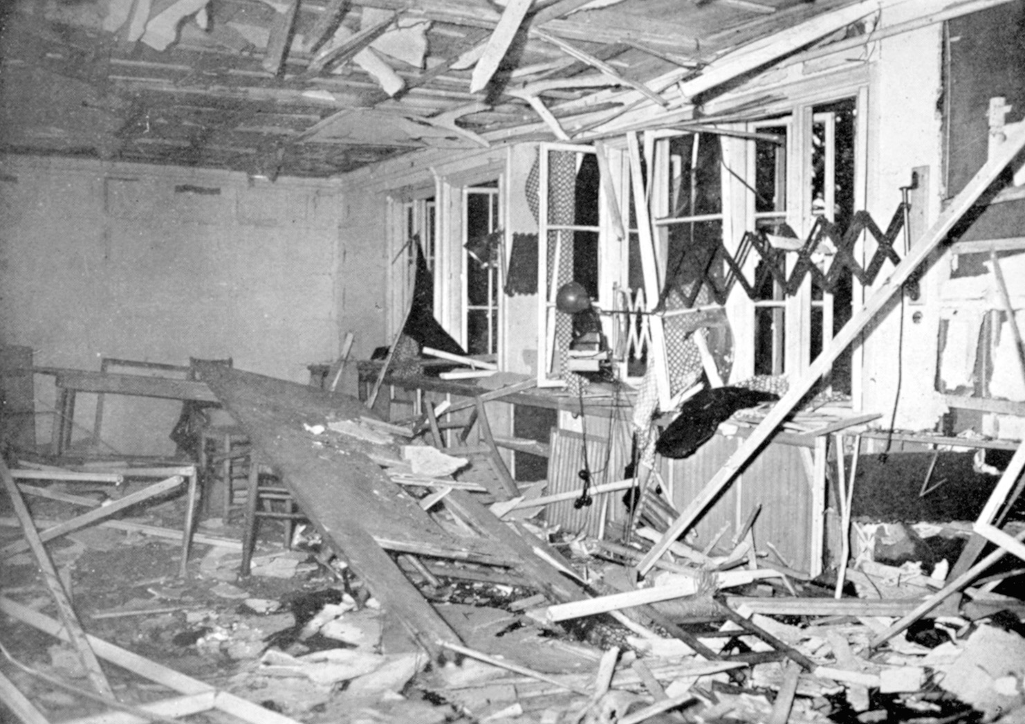 The conference room and table after the assassination attempt. Windows helped the blast spend its force outward.