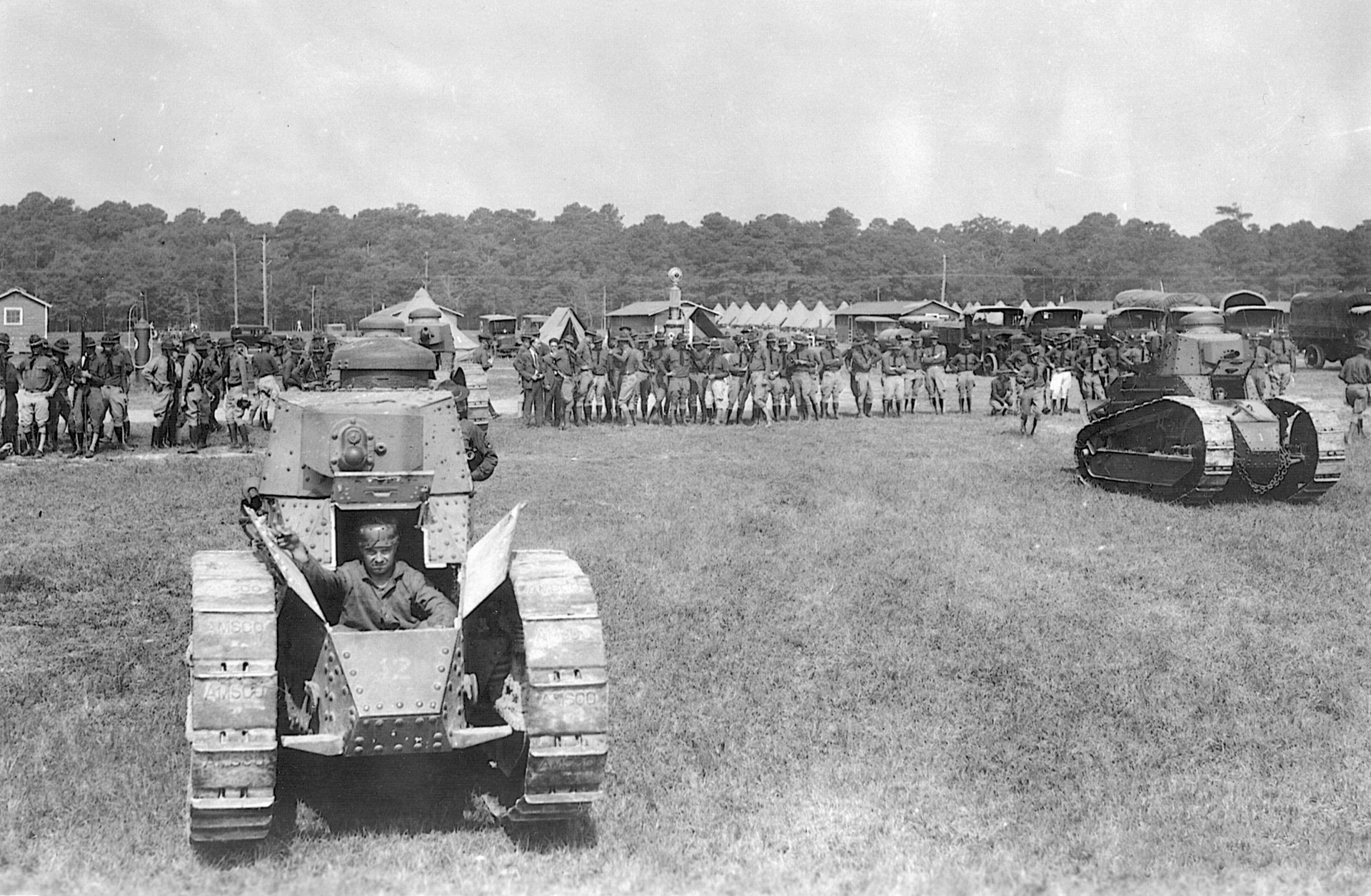 In September 1936, tanks of the U.S. Army are put through their paces before an interested crowd at Virginia Beach, Va.