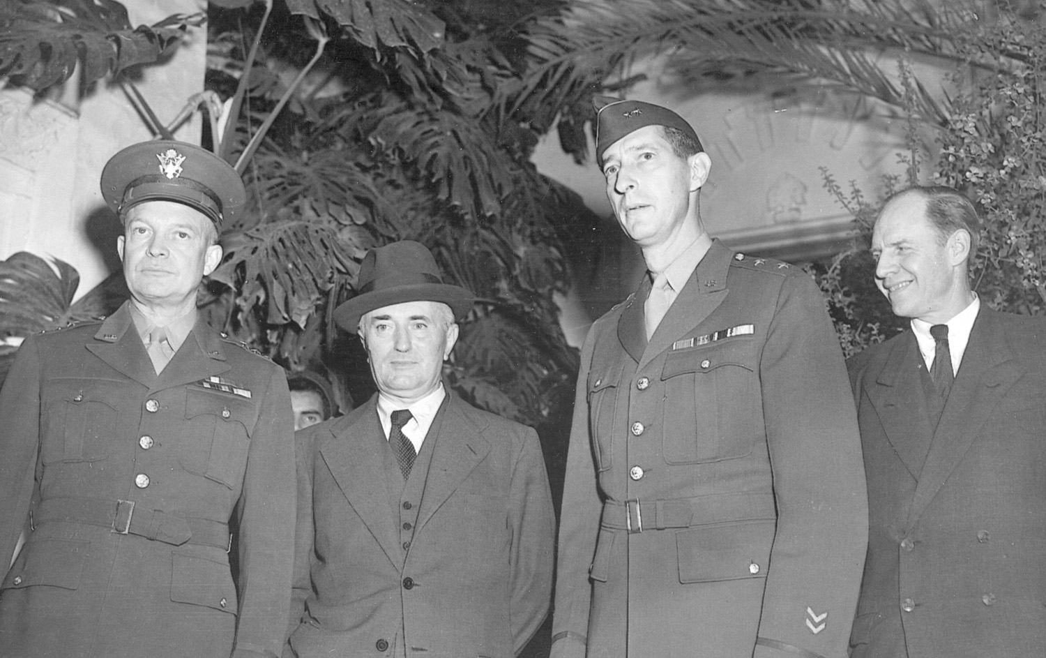 Admiral Darlan is flanked by Lt. Gen. Dwight D. Eisenhower (left), commander of the U.S. forces in North Africa; Eisenhower’s deputy, Maj. Gen. Mark Clark, and an unidentified diplomat during negotiations on November 13, 1942.