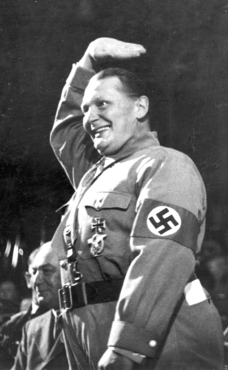 A beaming Göring, installed as Prime Minister of Prussia by Hitler, gives an informal Nazi salute.