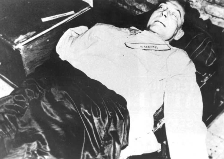 After his conviction at Nuremberg, Göring cheated the hangman with cyanide. Here, his body lies on top of its coffin. Göring was cremated and his ashes dumped into the Iser River near Munich along with those of other executed Nazi war criminals.