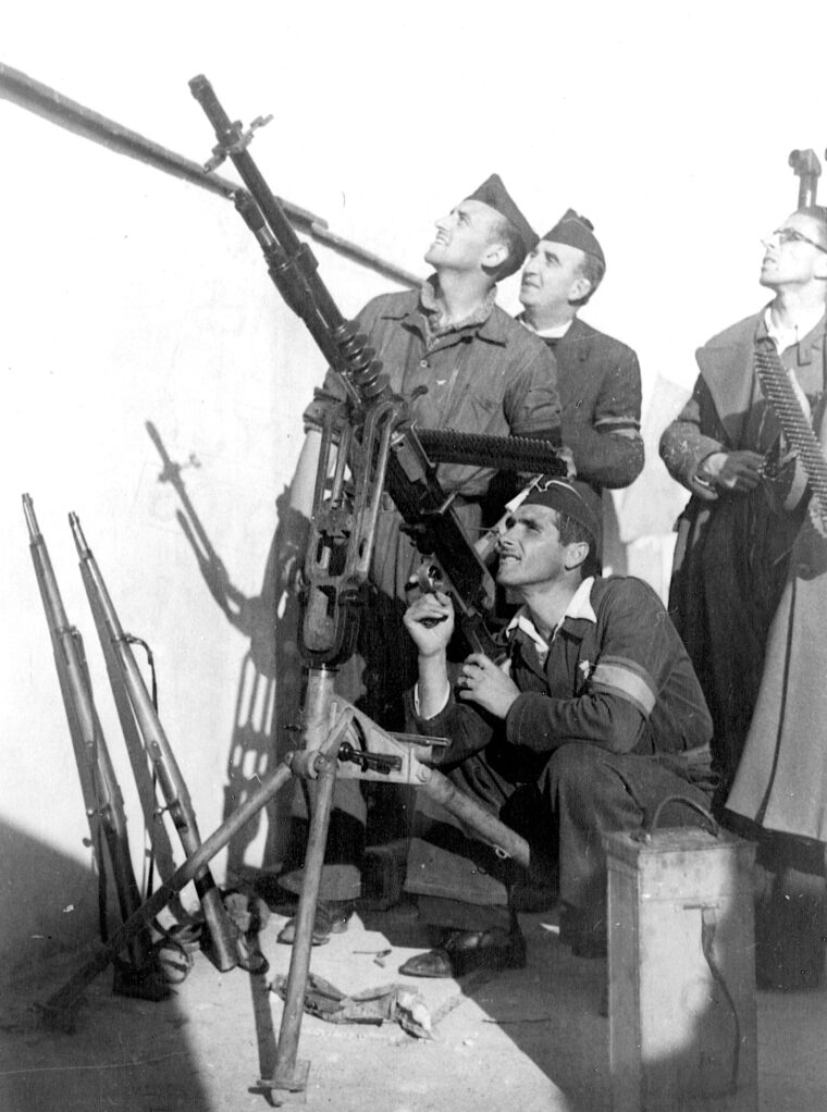 During the Spanish Civil War, which Hemingway believed was the beginning of World War II, Loyalist soldiers man an antiaircraft gun on the roof of a building in Oviedo, March 11, 1936.