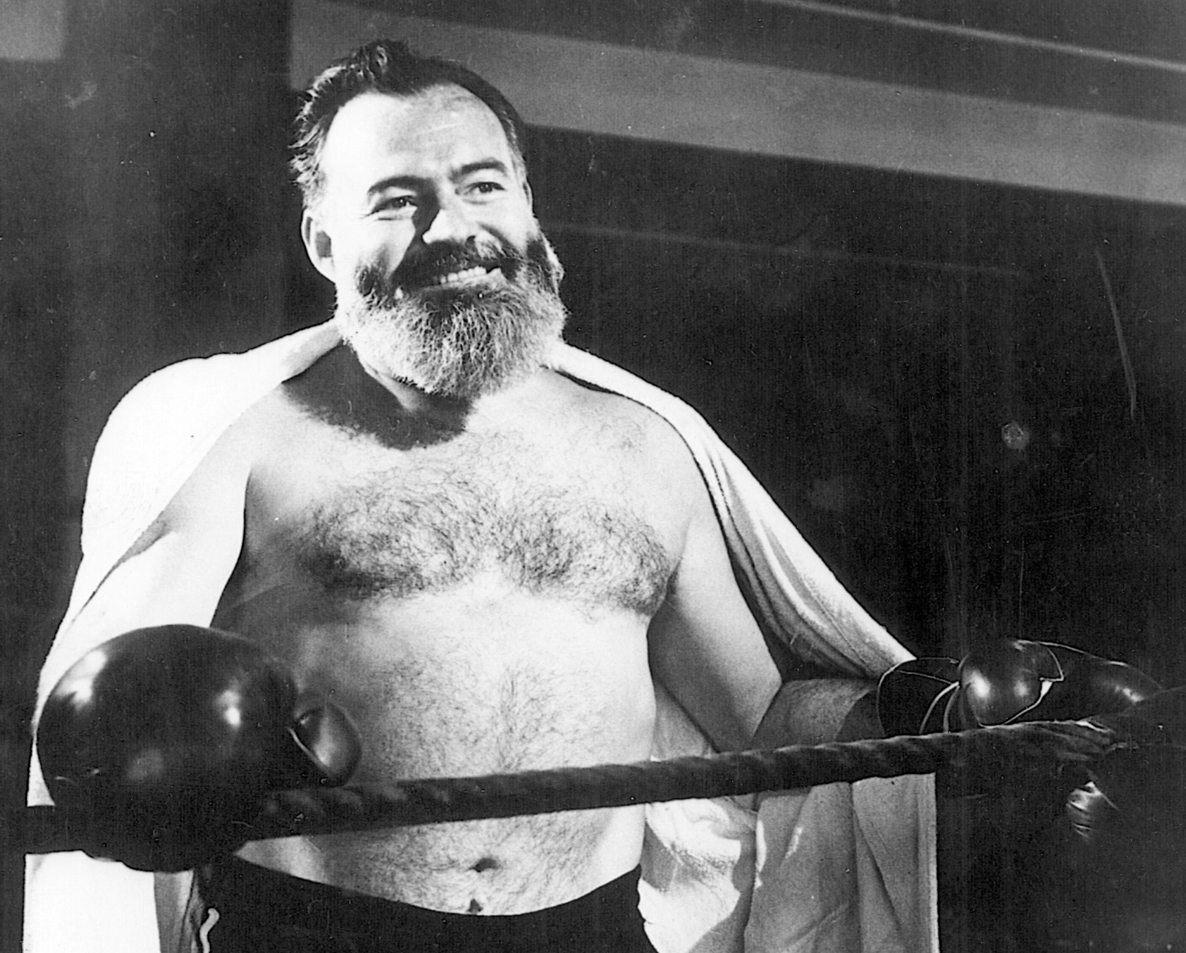 Hemingway gets ready to spar in the boxing ring prior to his departure for European adventures as a war correspondent.