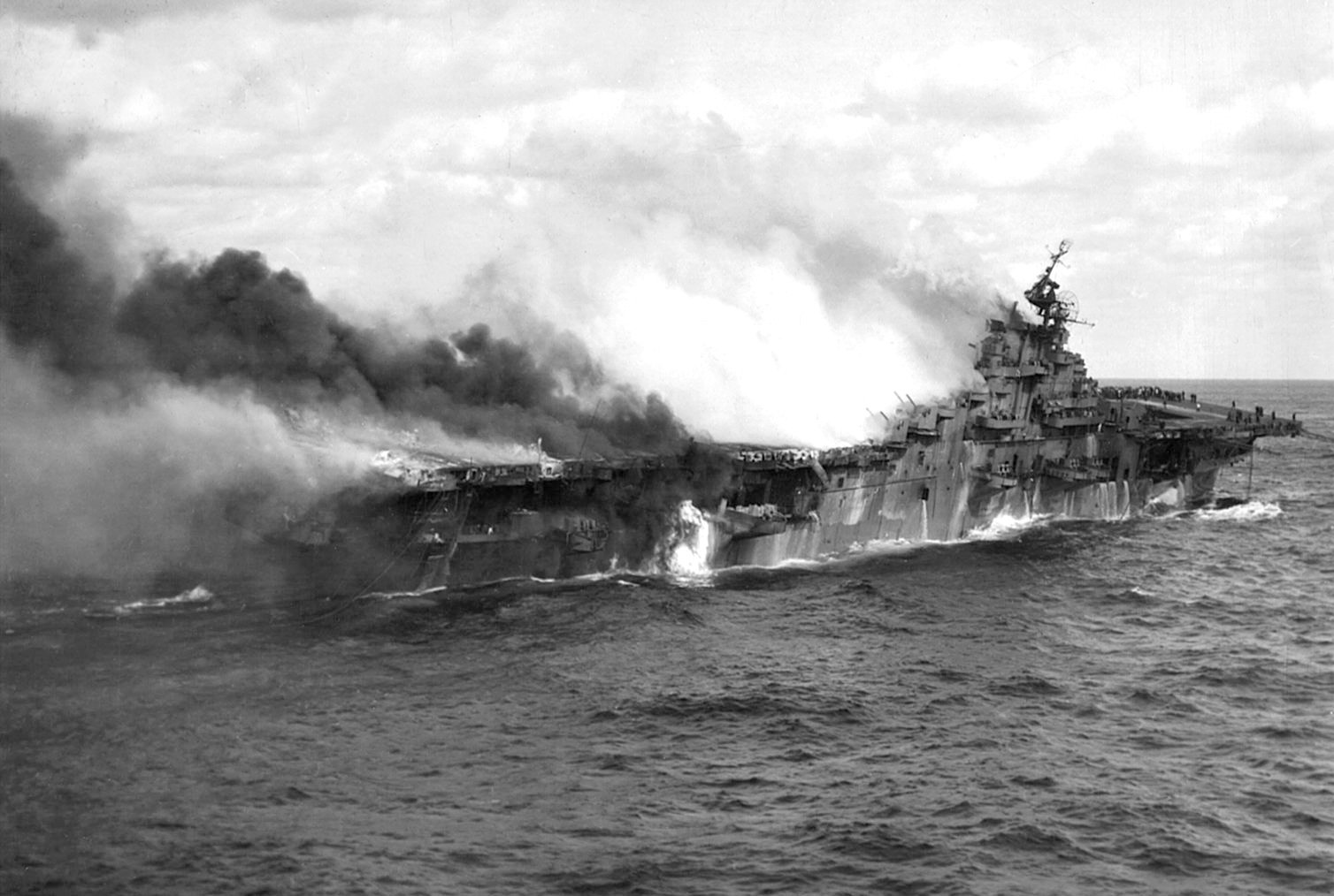 The Franklin burns furiously and begins to list after being hit by a pair of Japanese bombs.