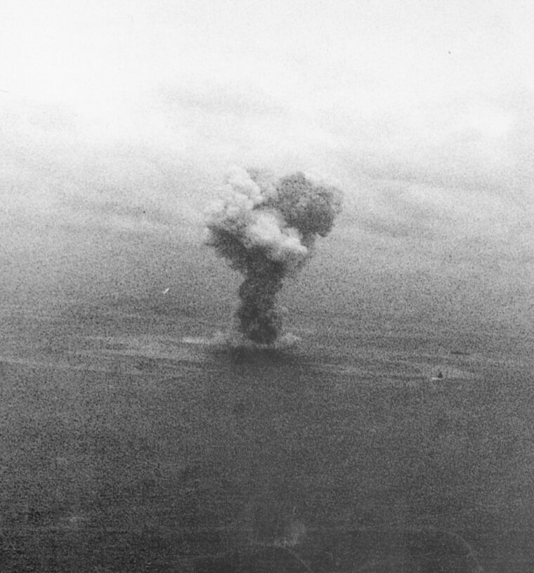 A huge explosion hammers the Yamato after she has taken tremendous punishment from American aircraft.