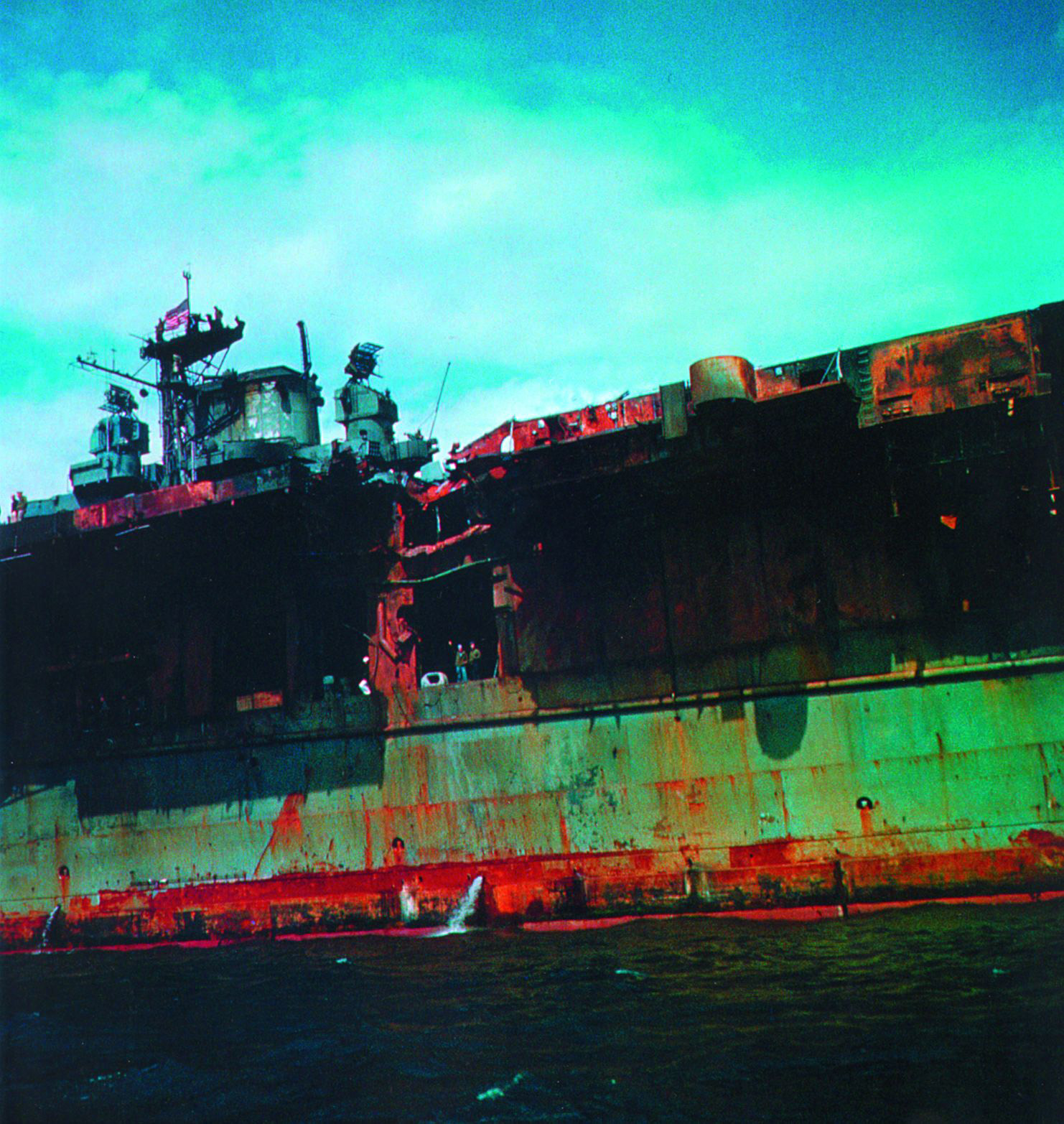 The extent of the damage suffered by the Franklin is evidenced by the rust and peeling paint on the vessel’s hull, which resulted from the intense heat generated by the shipboard fires.