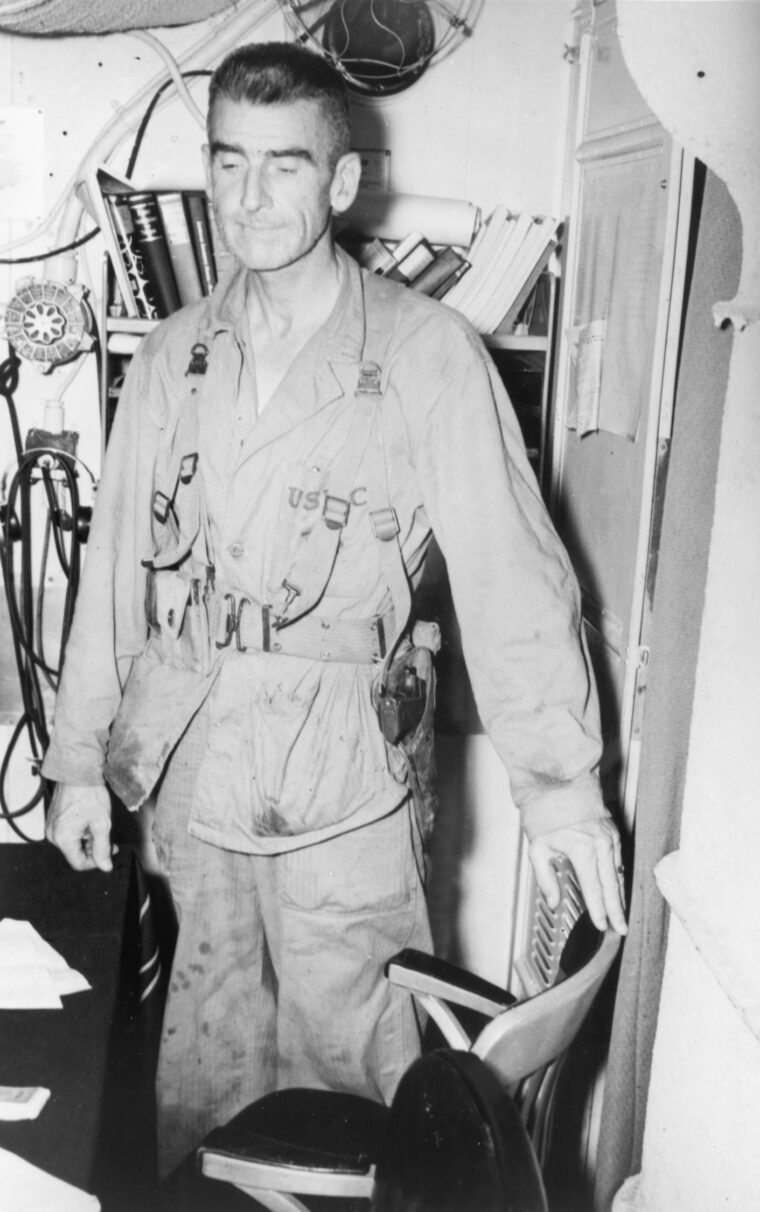 Fatigue is evident on the face of Lt. Col. Evans F. Carlson as he boards the submarine USS Nautilus following the Makin raid.