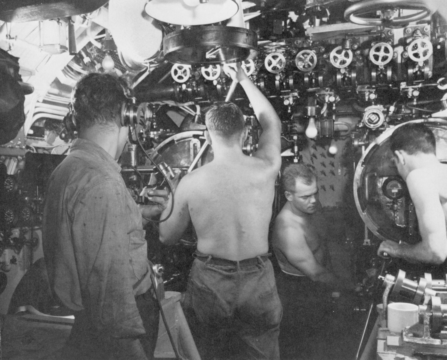 Torpedomen aboard a U.S. submarine ready their tubes for an attack against an enemy vessel.