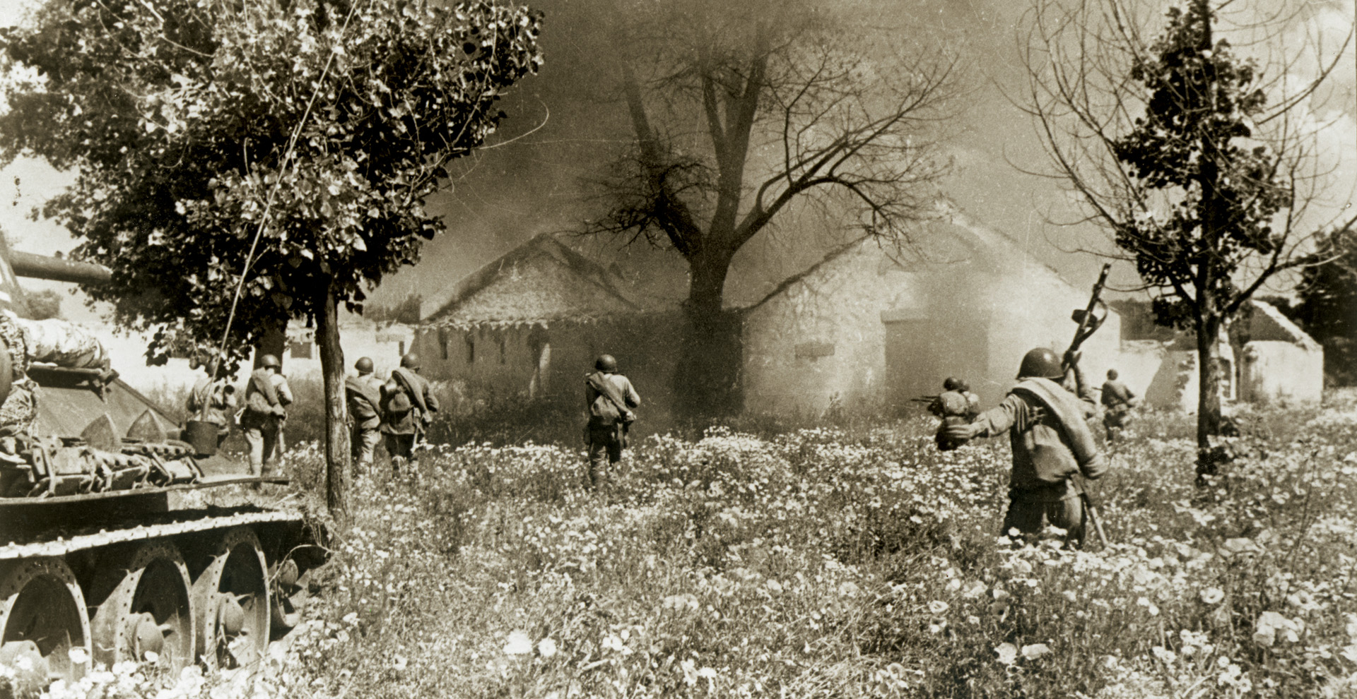 With armor support, Red Army soldiers advance toward a burning farmhouse in the rugged Carpathian Mountain region. Hitler thought that the Soviet counteroffensive had run out of steam—but he was wrong.