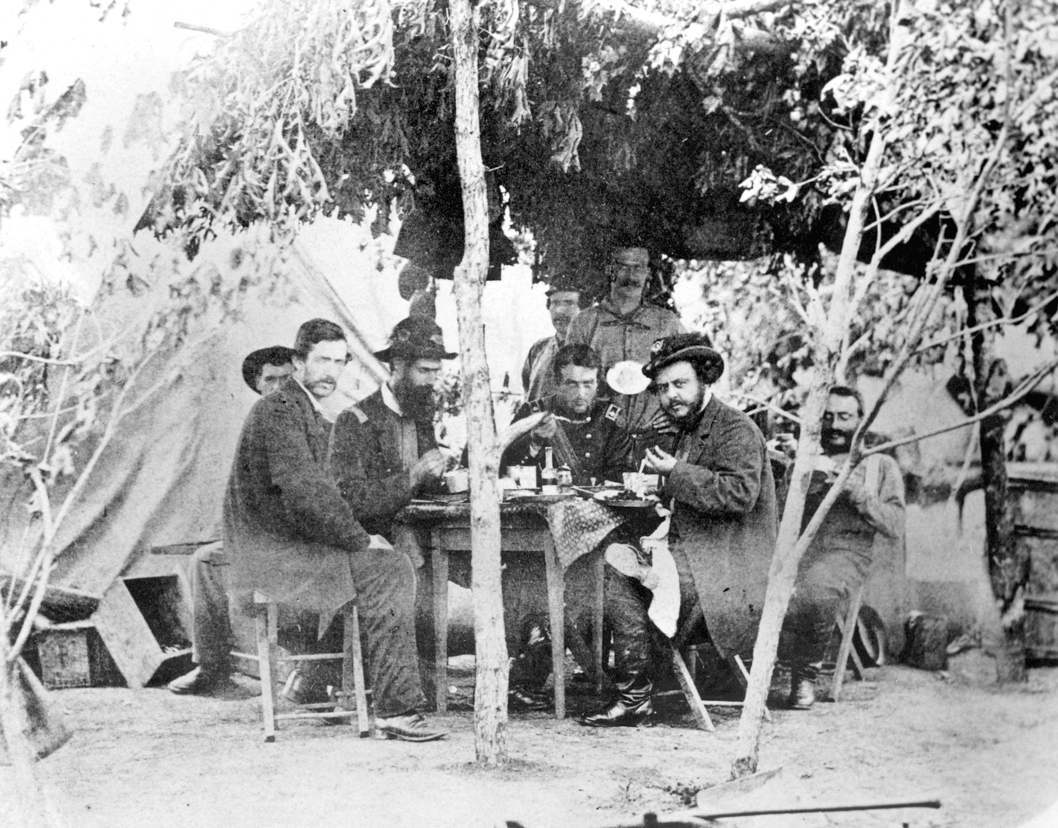 The headquarters staff of the 2nd Wisconsin eat their lunch somewhere in Chain Bridge, Virginia. 