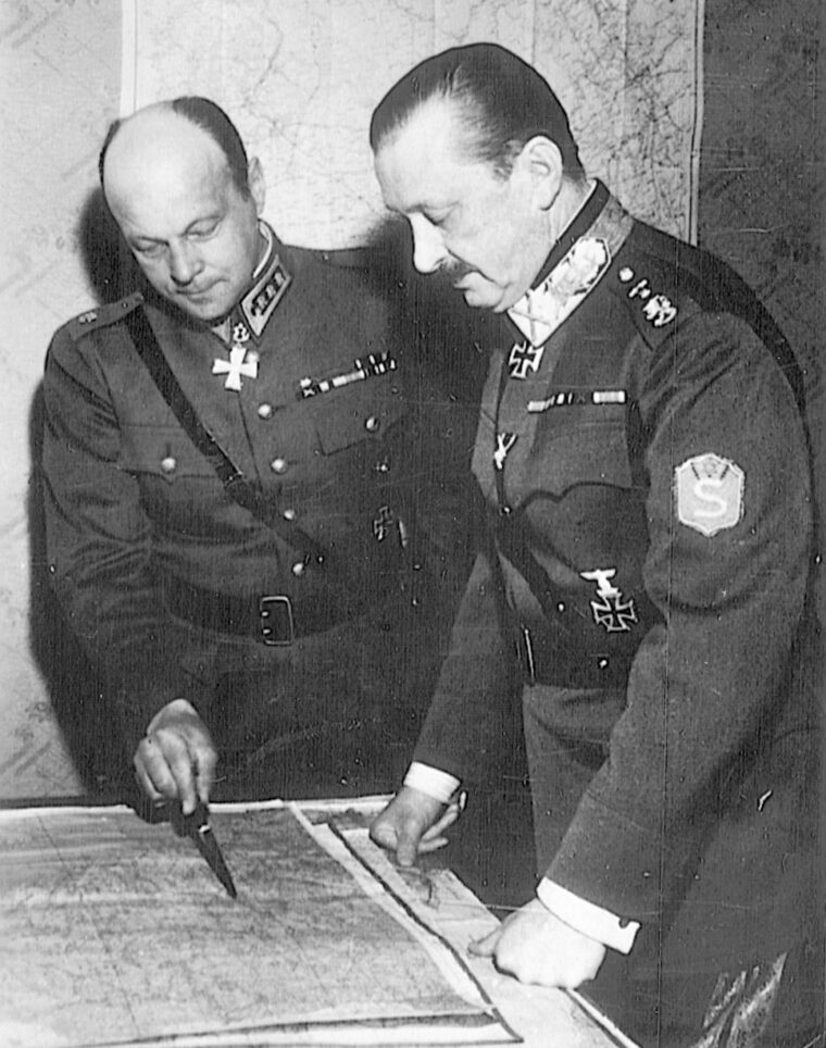 Finnish Lt. Gen. Axel Erik Heinrichs (left) reviews a map with his superior officer, Field Marshal Gunther Mannerheim. The Finns stubbornly maintained independent command while fighting alongside their German allies.