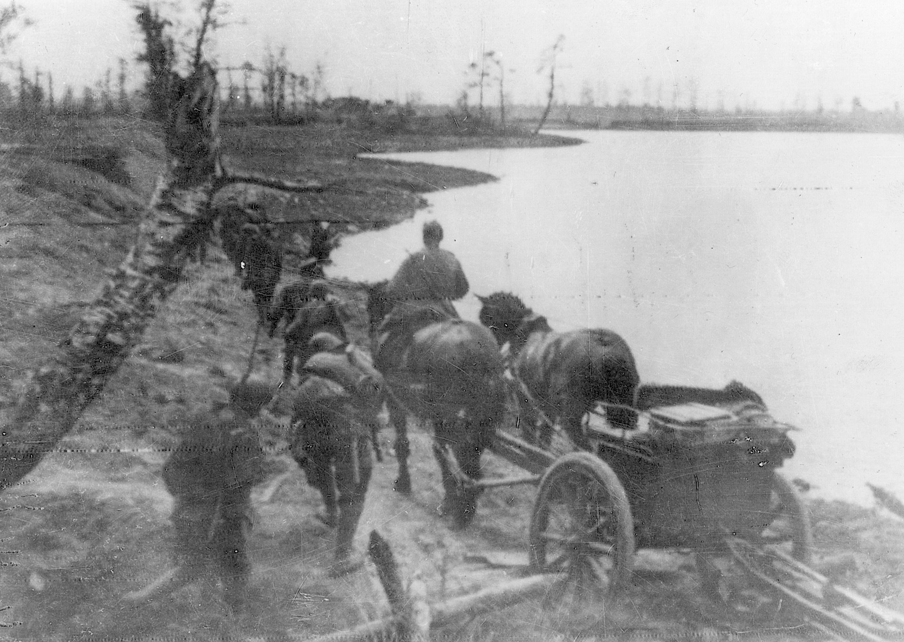 Russian troops move equipment along the banks of a river on the Karelian Isthmus. Fighting the Germans and the Finns, the Red Army was successful in keeping the vital Murmansk supply route open.