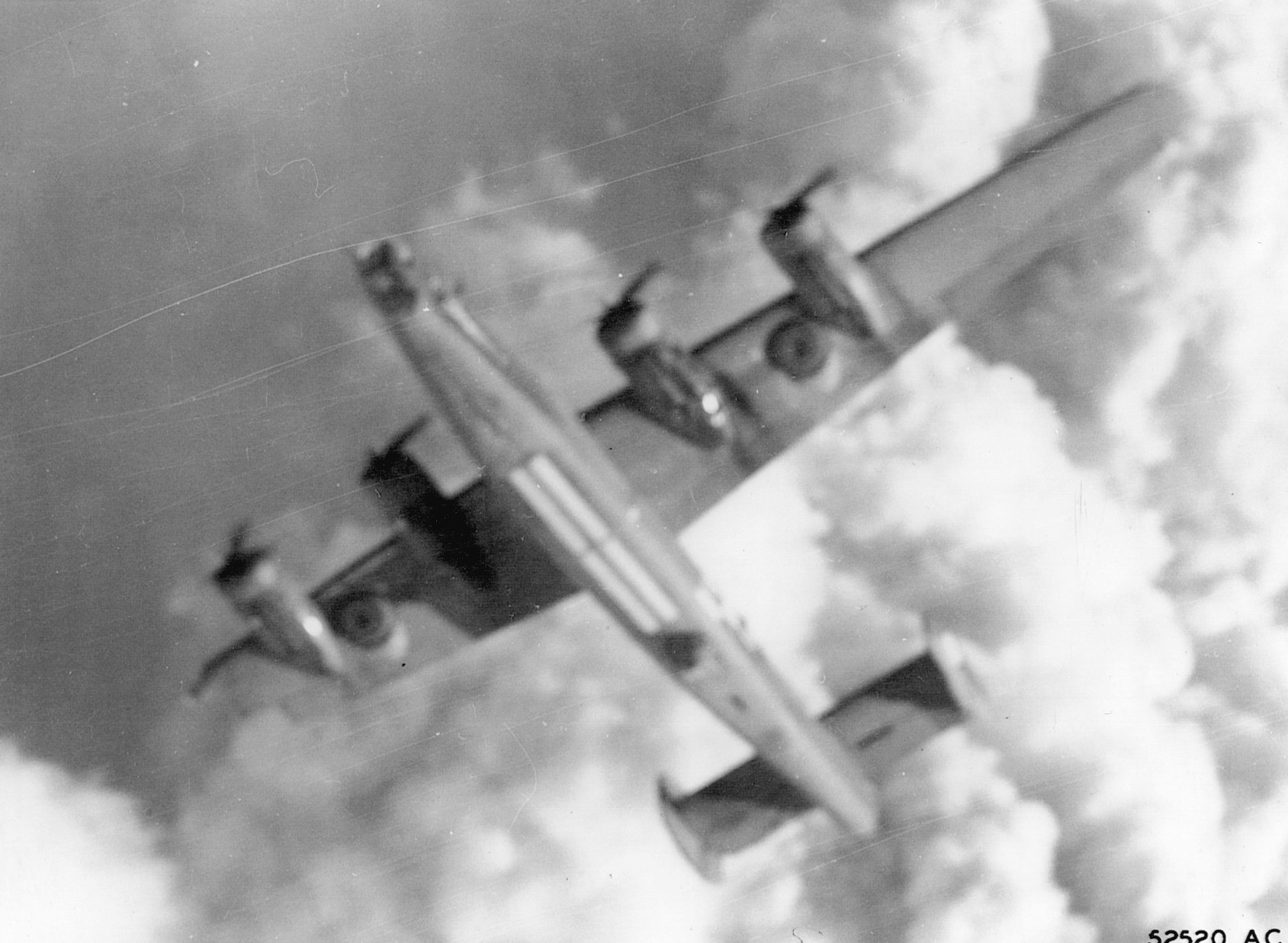 Crippled by intense antiaircraft fire, a B-24 spins out of control and heads earthward during the August 1, 1943, Ploesti attack.