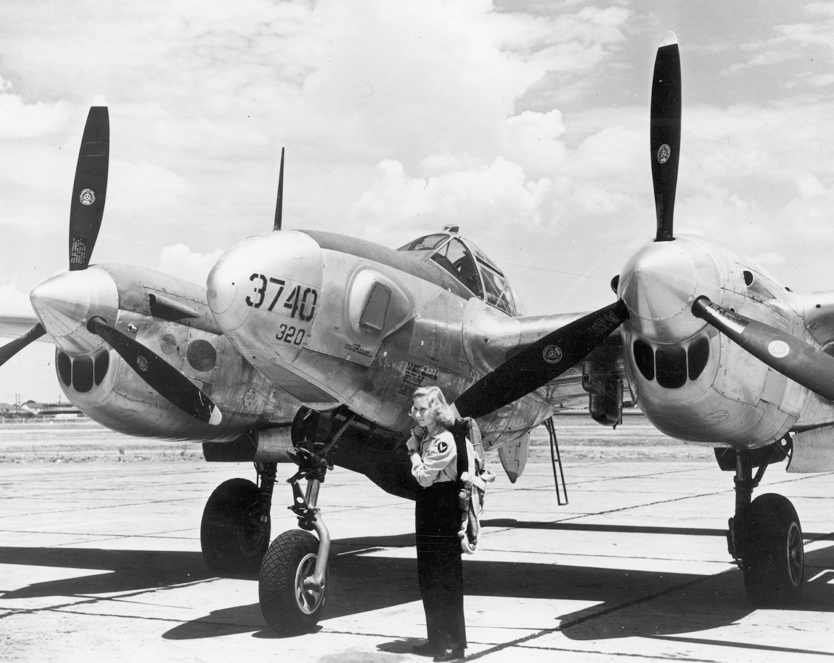 WASP Louisa Thompson checks out a Lockheed P-38 Lightning she is preparing to fly.