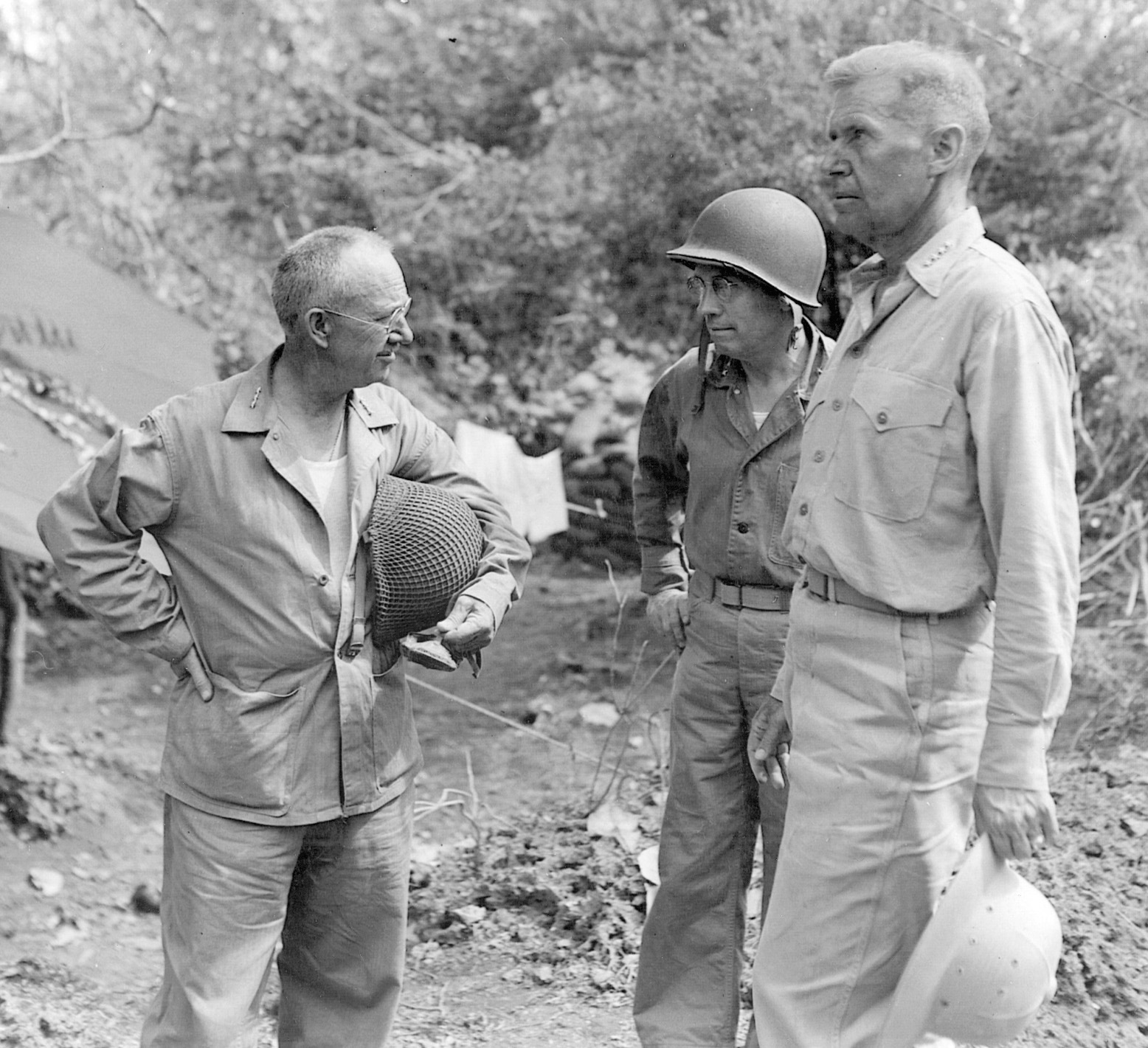 Marine Lieutenant General Holland M. Smith, Saipan ground commander, confers with Major General Thomas E. Watson and Admiral Raymond A. Spruance.