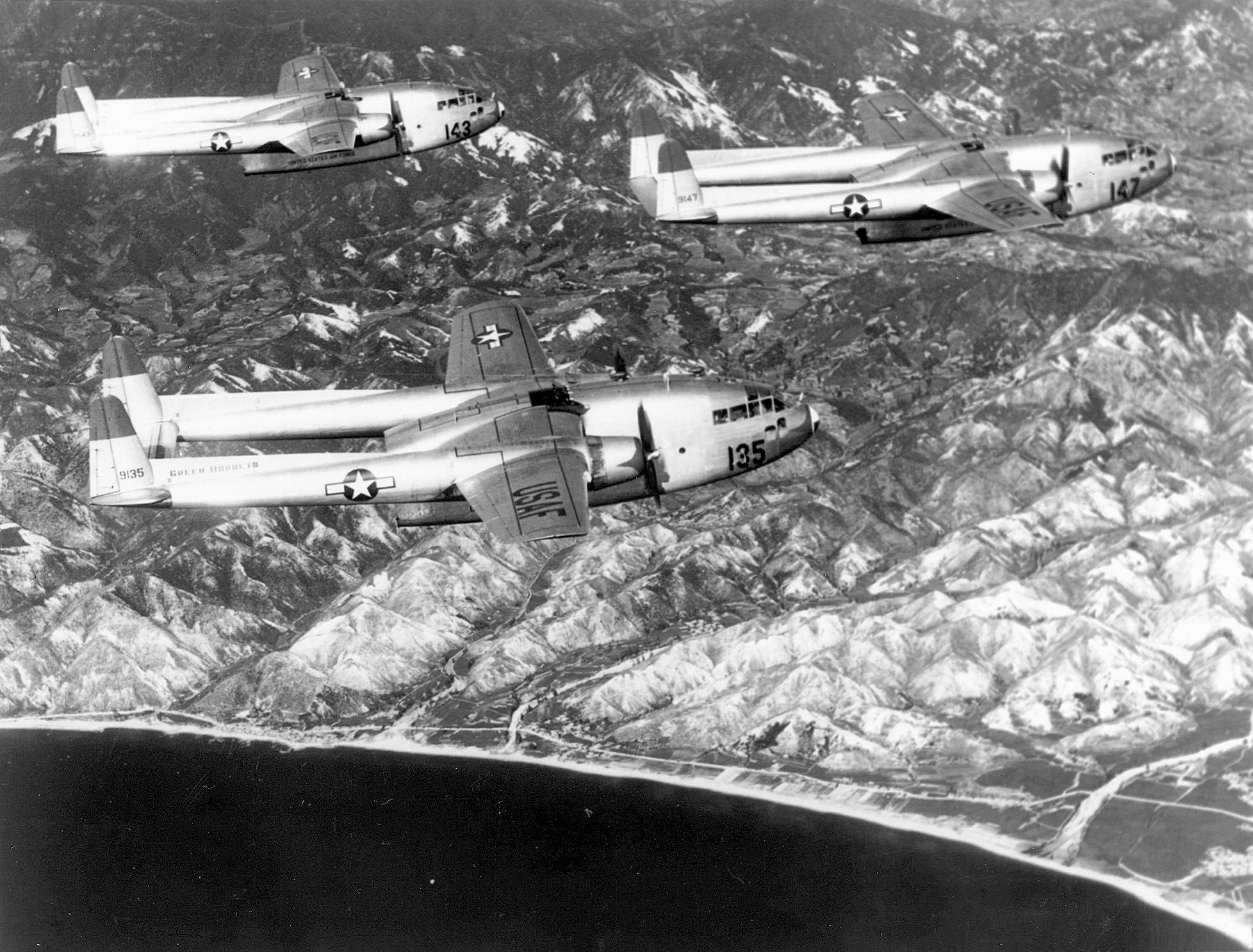 Air Force “Flying Boxcars” that dropped bridge parts to the struggling columns below.