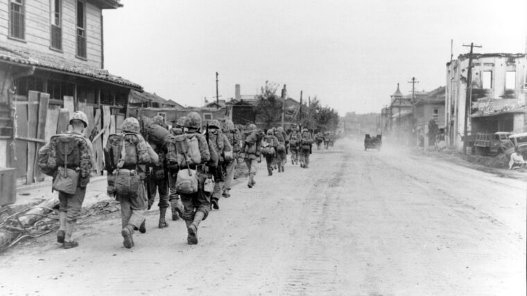 Elements of the First Marine Division move inland through Inchon in their drive to cut the supply and communications of the North Korean armies pressing on the United Nations forces to the south.