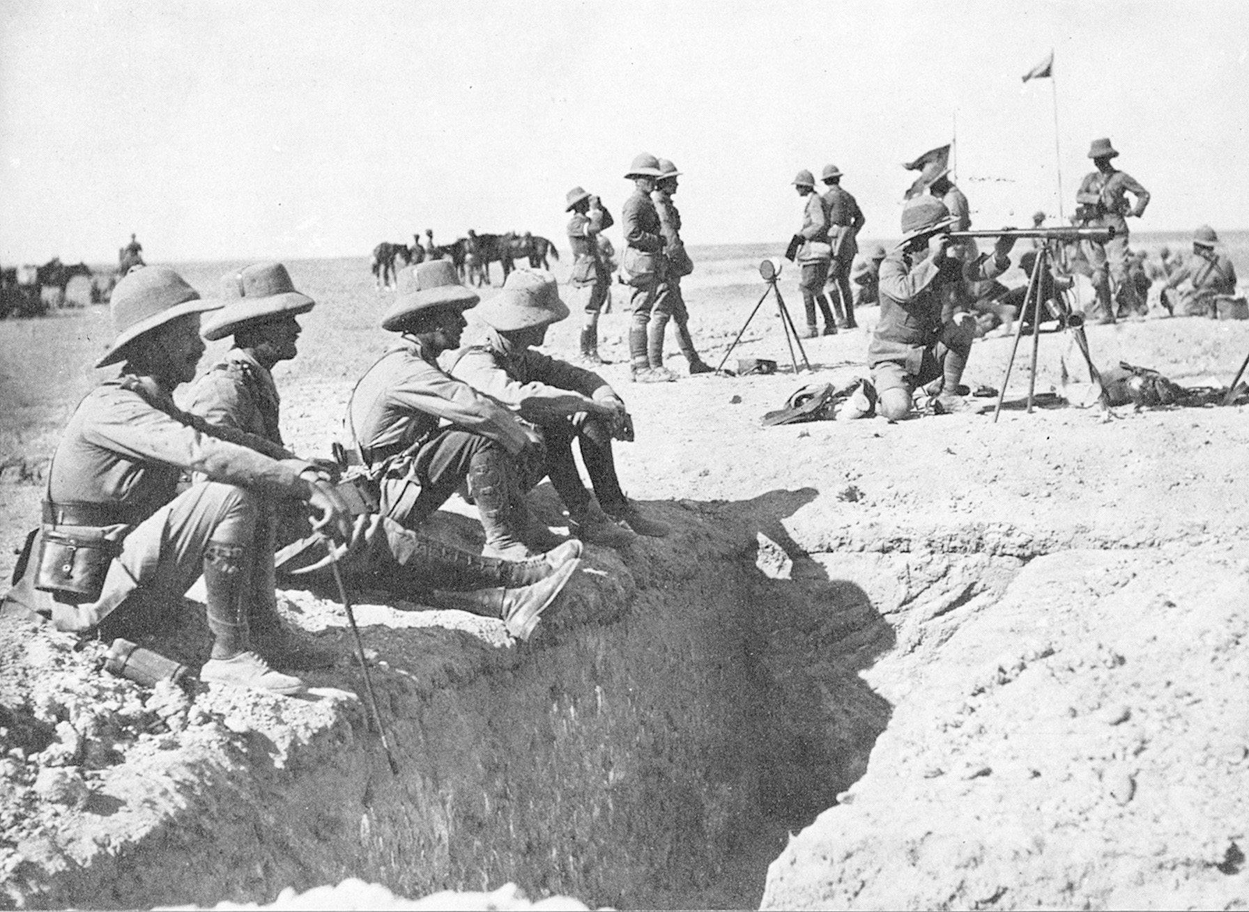 British officers gather by captured Turkish trenches on the Palestine Front. 